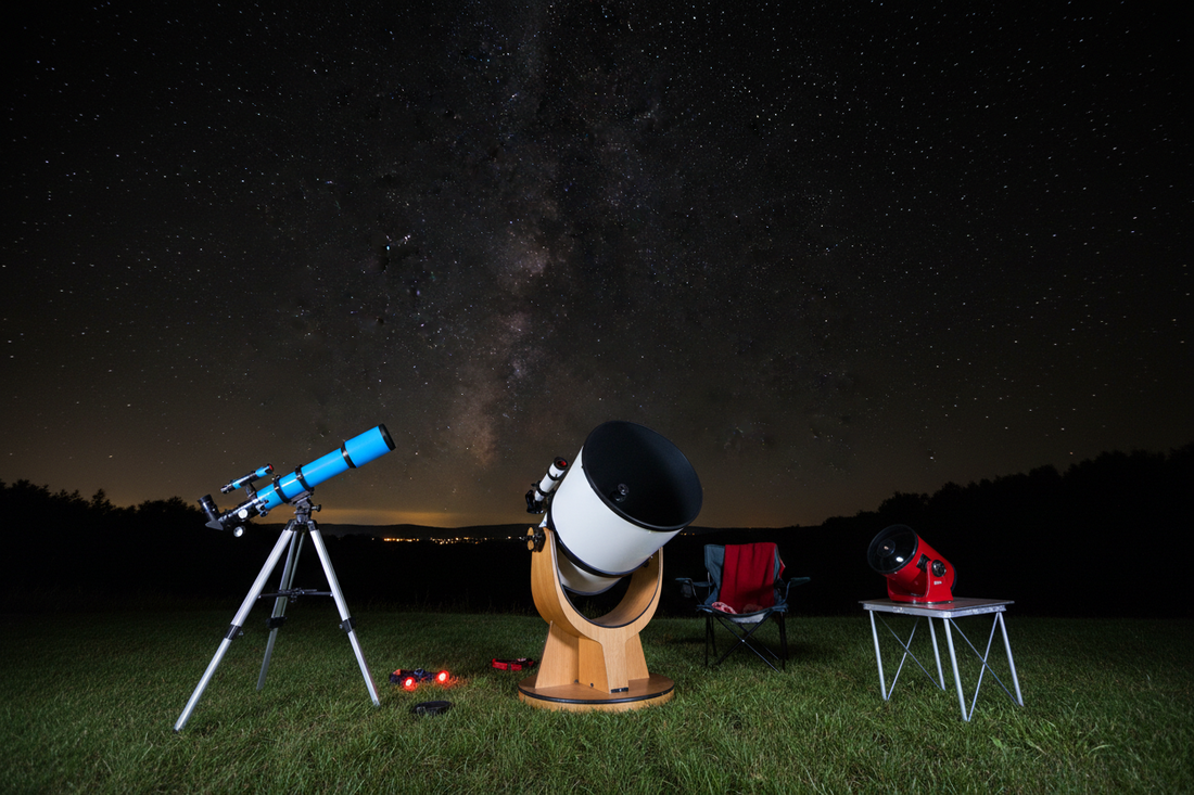 Three beginner telescopes side by side under night sky: refractor on tripod, Dobsonian reflector, and tabletop telescope